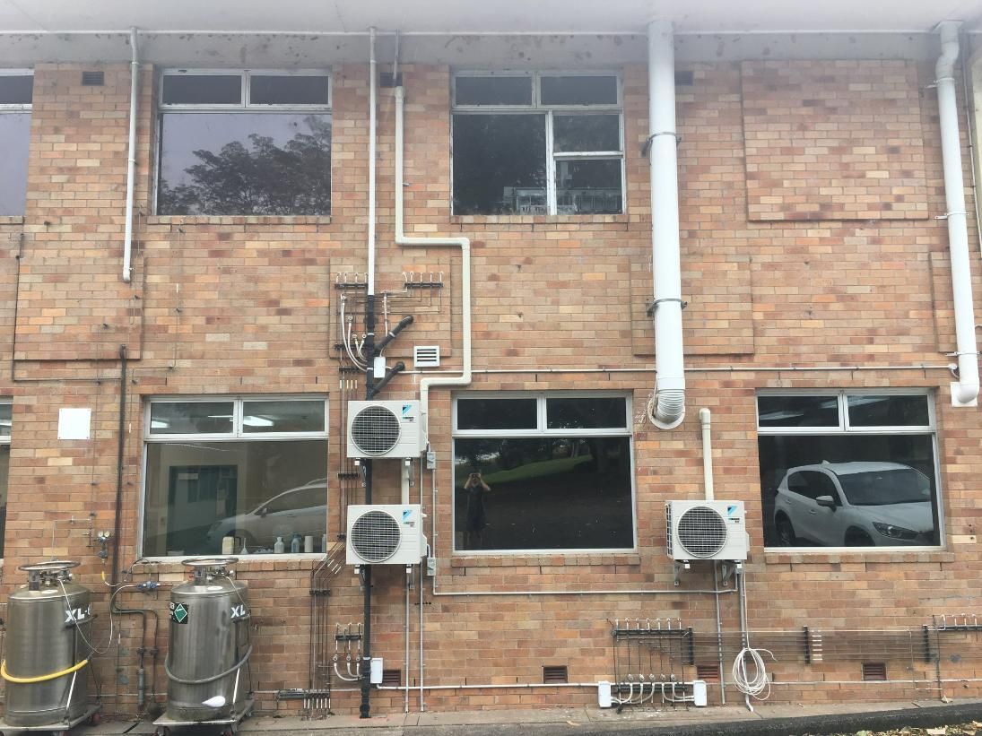 A Brick Building with A Lot of Windows and Air Conditioners on The Side — Northernair in East Lismore, NSW