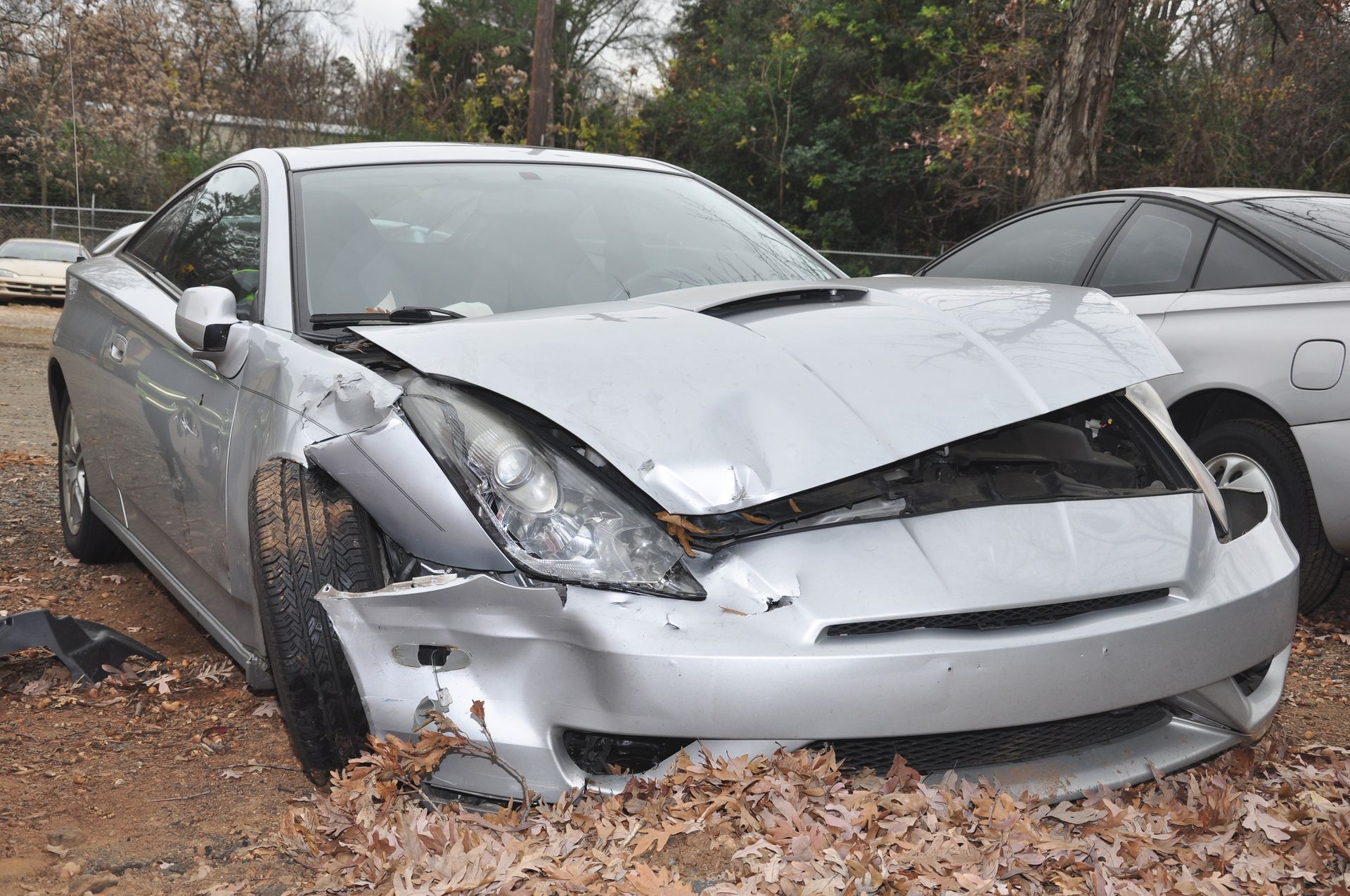 gray sedan wrecked after a front end collision