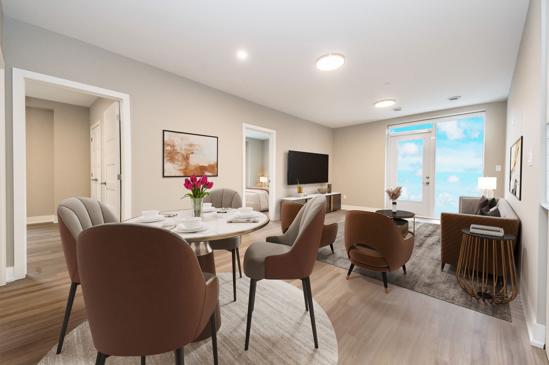 A living room with a dining table , chairs , a couch and a television.