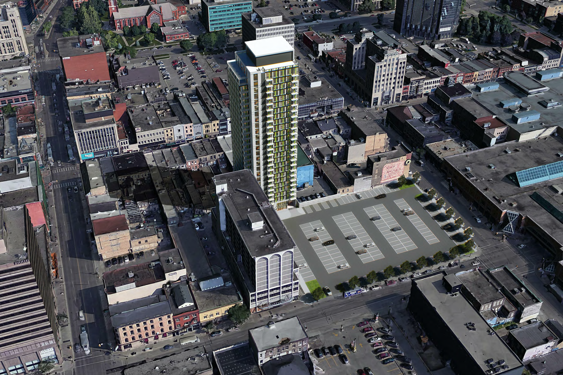 An aerial view of a city with a tall building in the middle