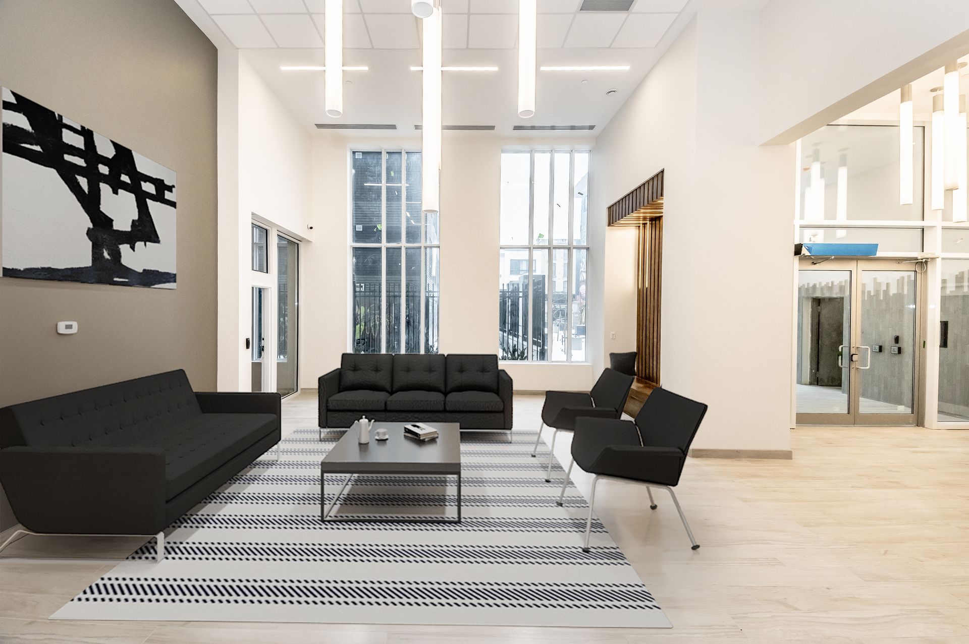 A living room with a couch , chairs and a coffee table