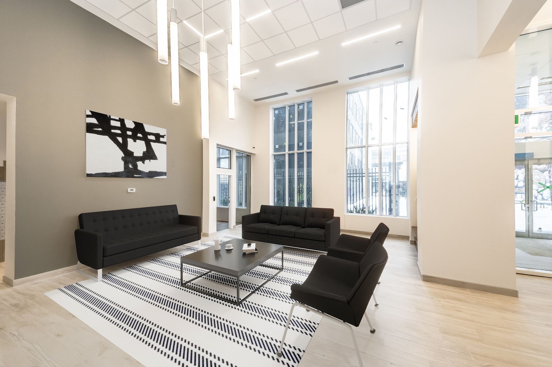 A living room with a lot of furniture and a large window