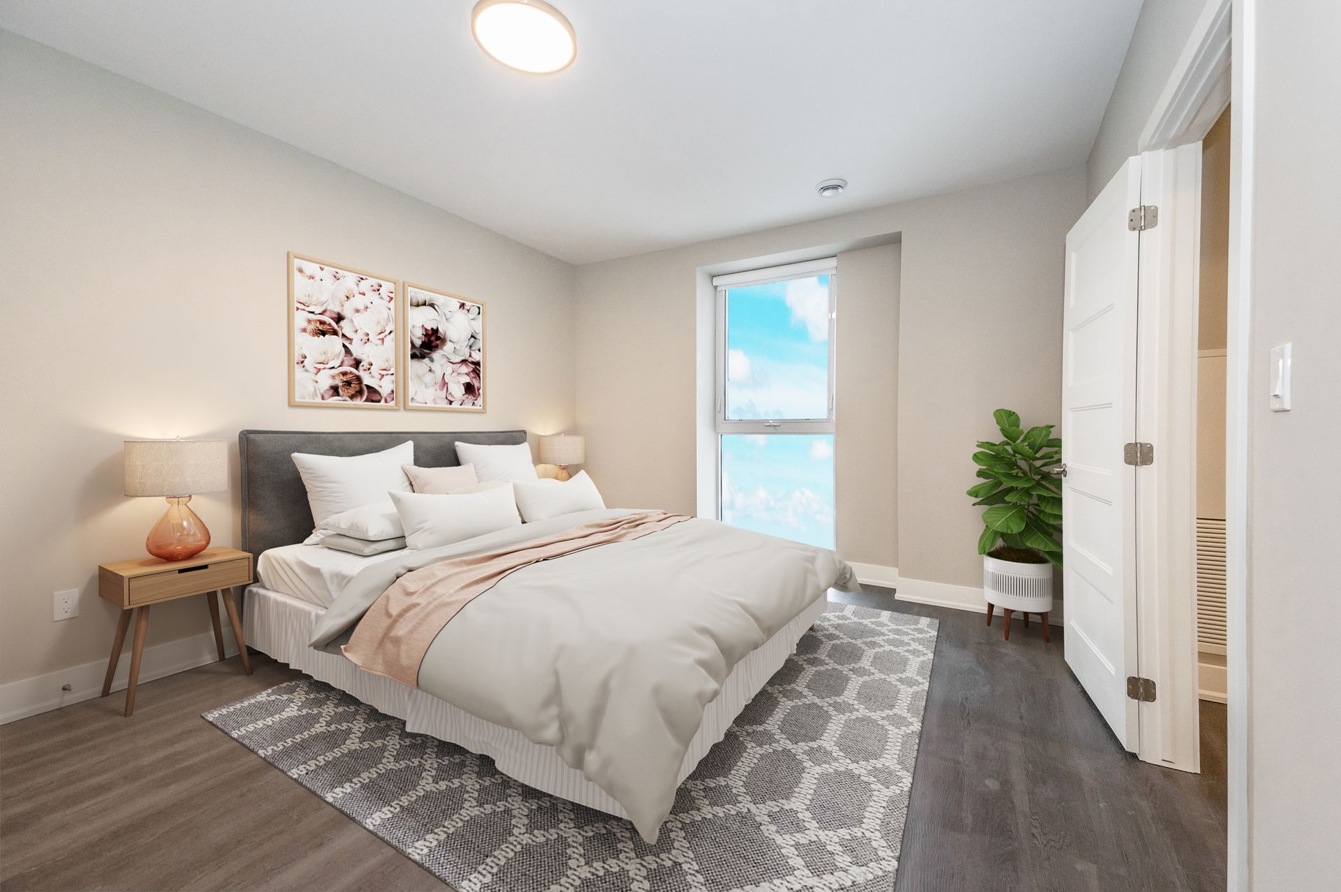 A bedroom with a large bed and a window.