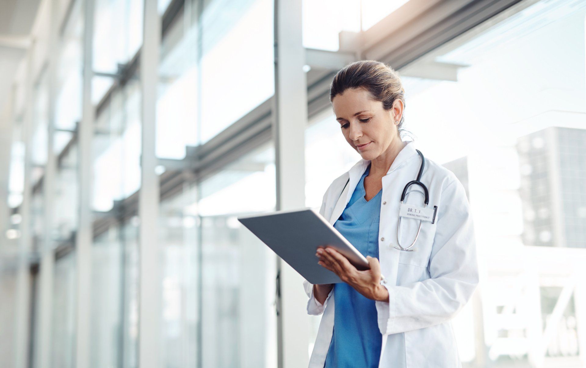 Female Doctor Using A Digital Tablet — Sylacauga, AL — Craddock Health Center