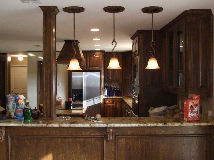 A box of cheerios sits on a counter in a kitchen