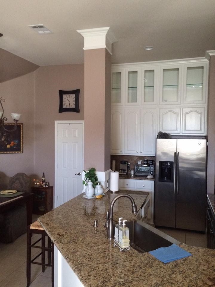 A kitchen with stainless steel appliances and granite counter tops