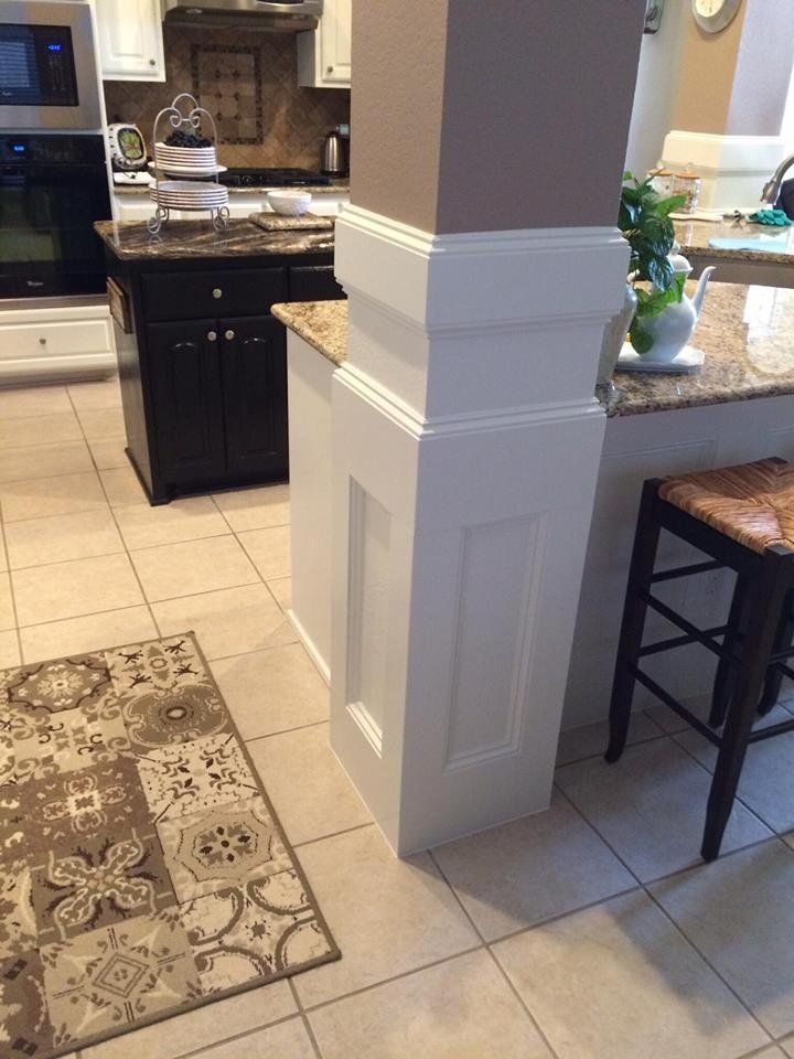 A kitchen with a rug on the floor and a rug on the floor.