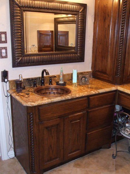 A bathroom with a sink and a large mirror