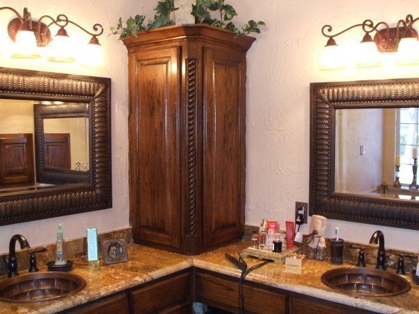 A bathroom with two sinks and two mirrors