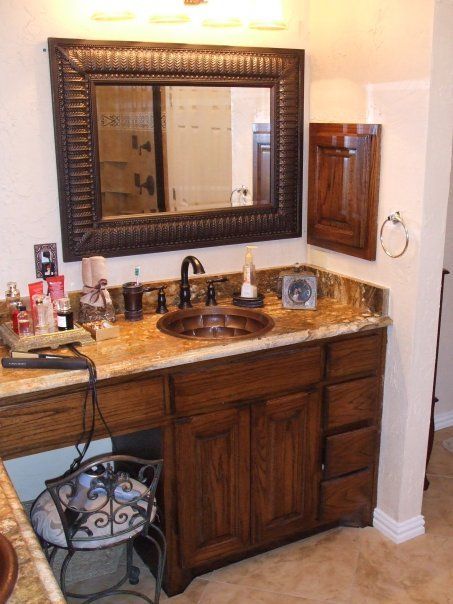 A bathroom with two sinks and a mirror