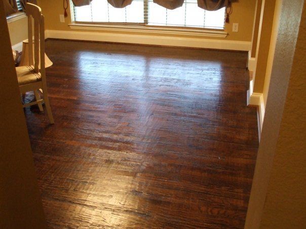 A room with a wooden floor and a window