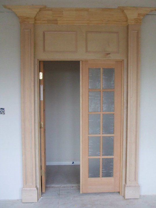 A door with a sliding glass door in a room