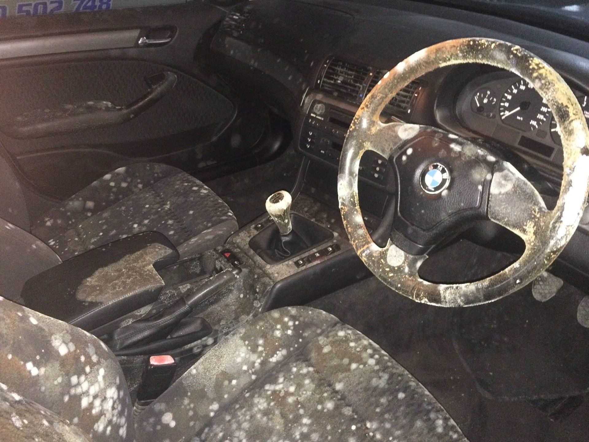 The inside of a car covered in mould