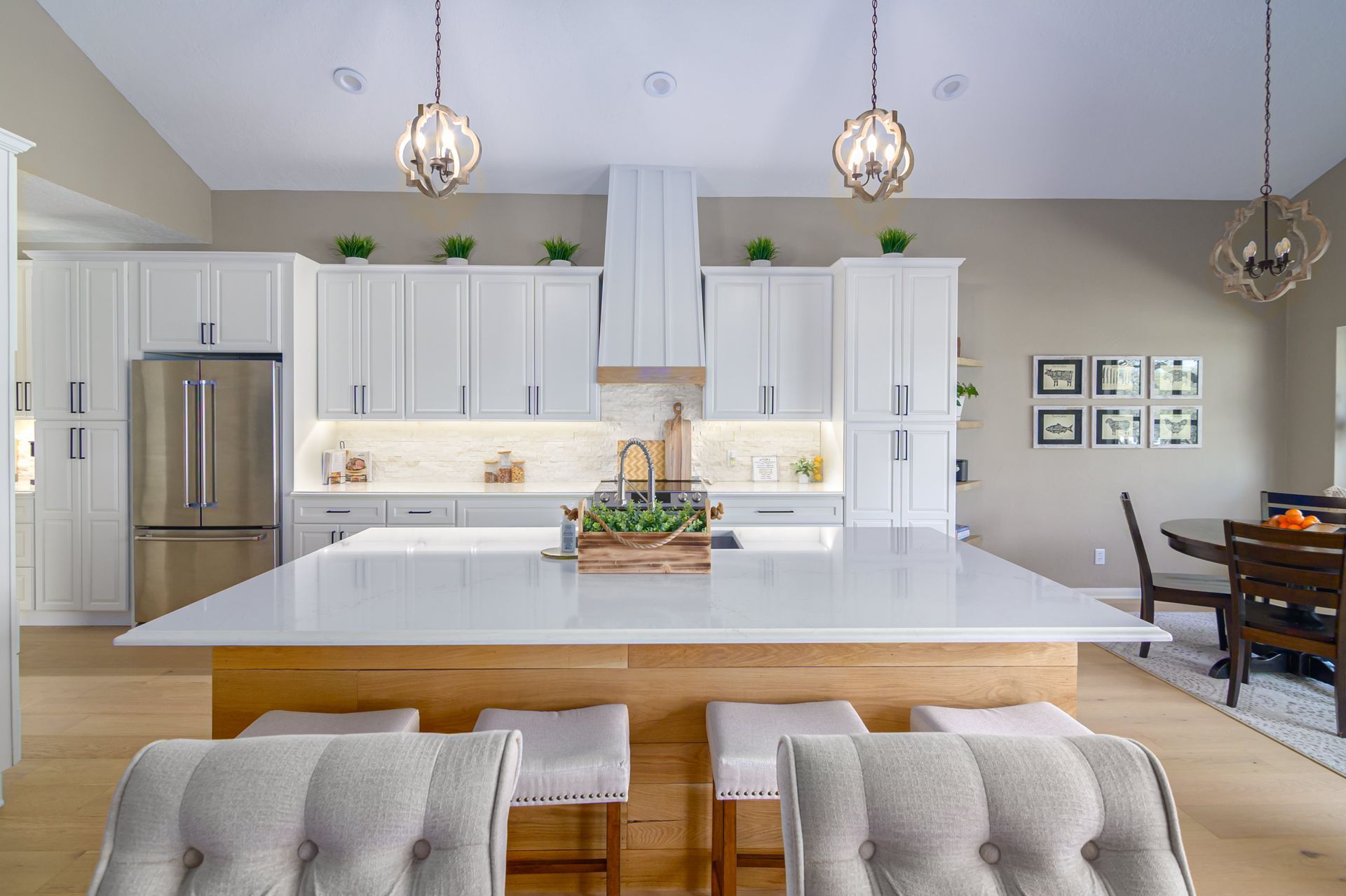 There is a large island in the middle of the kitchen.