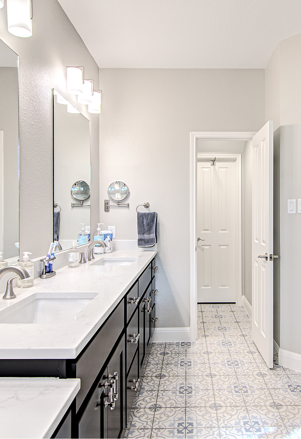 A bathroom with a tub , shower , and window.
