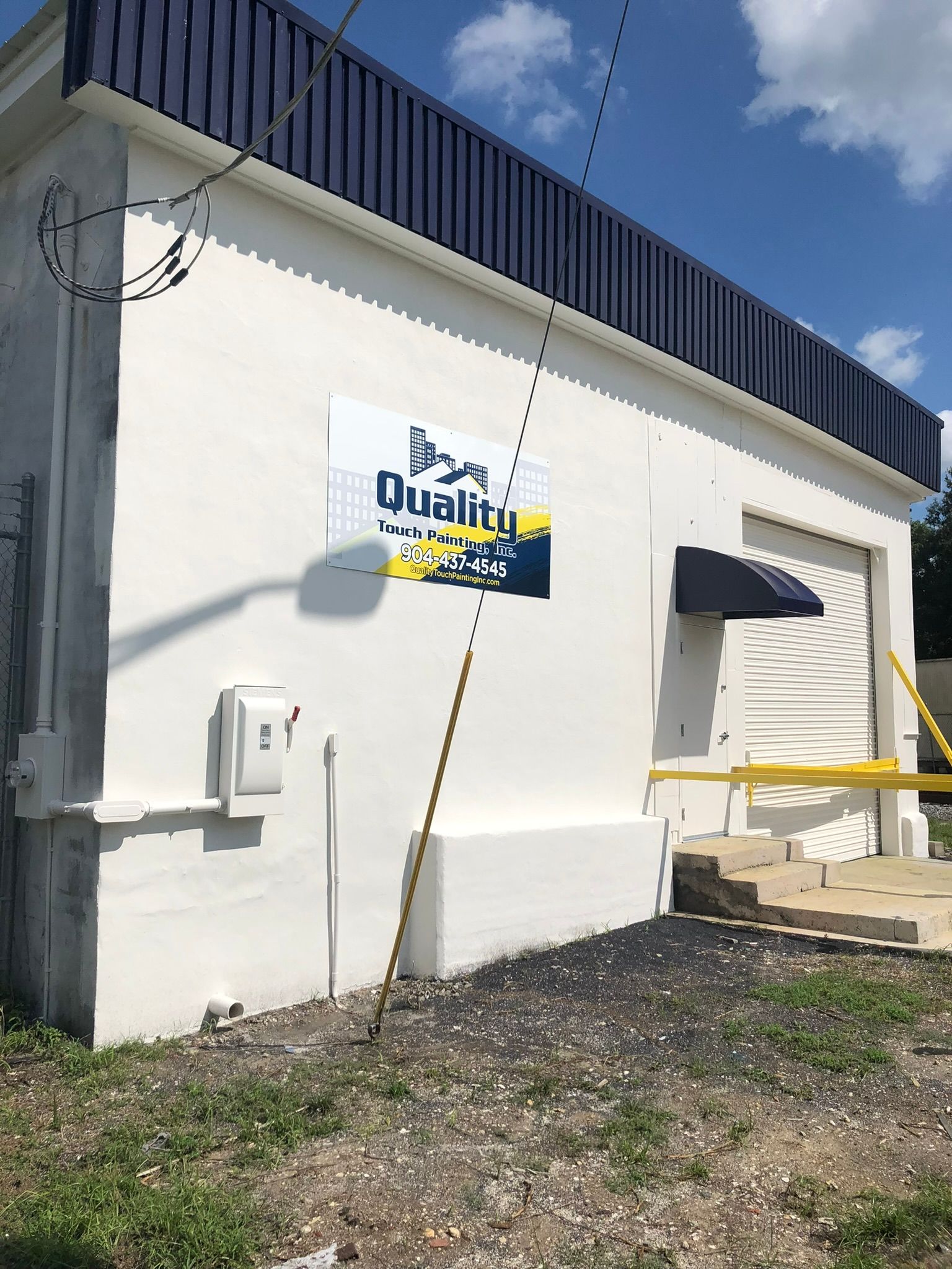 White building with blue trim, 