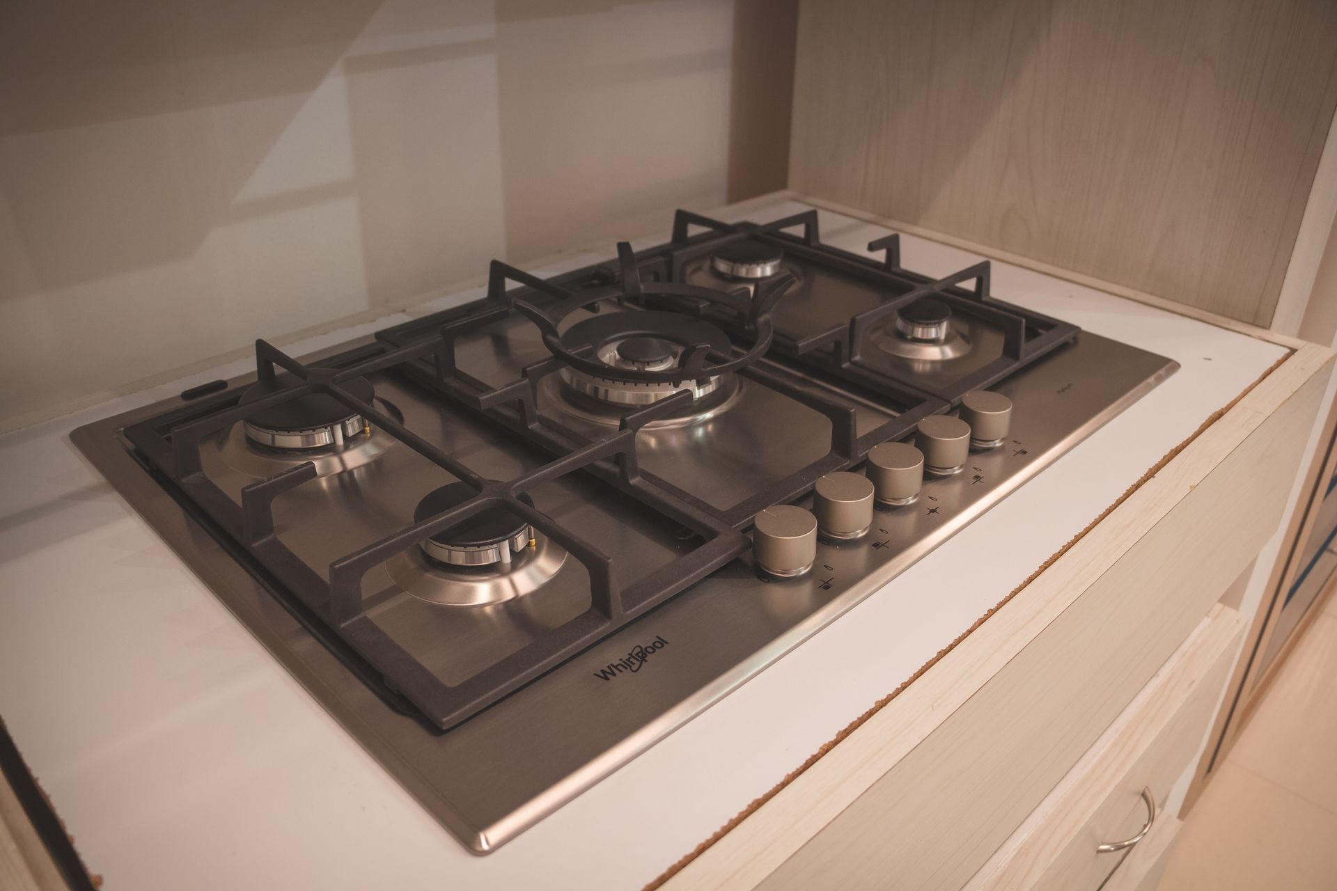 A stove top oven is sitting on top of a counter in a kitchen.