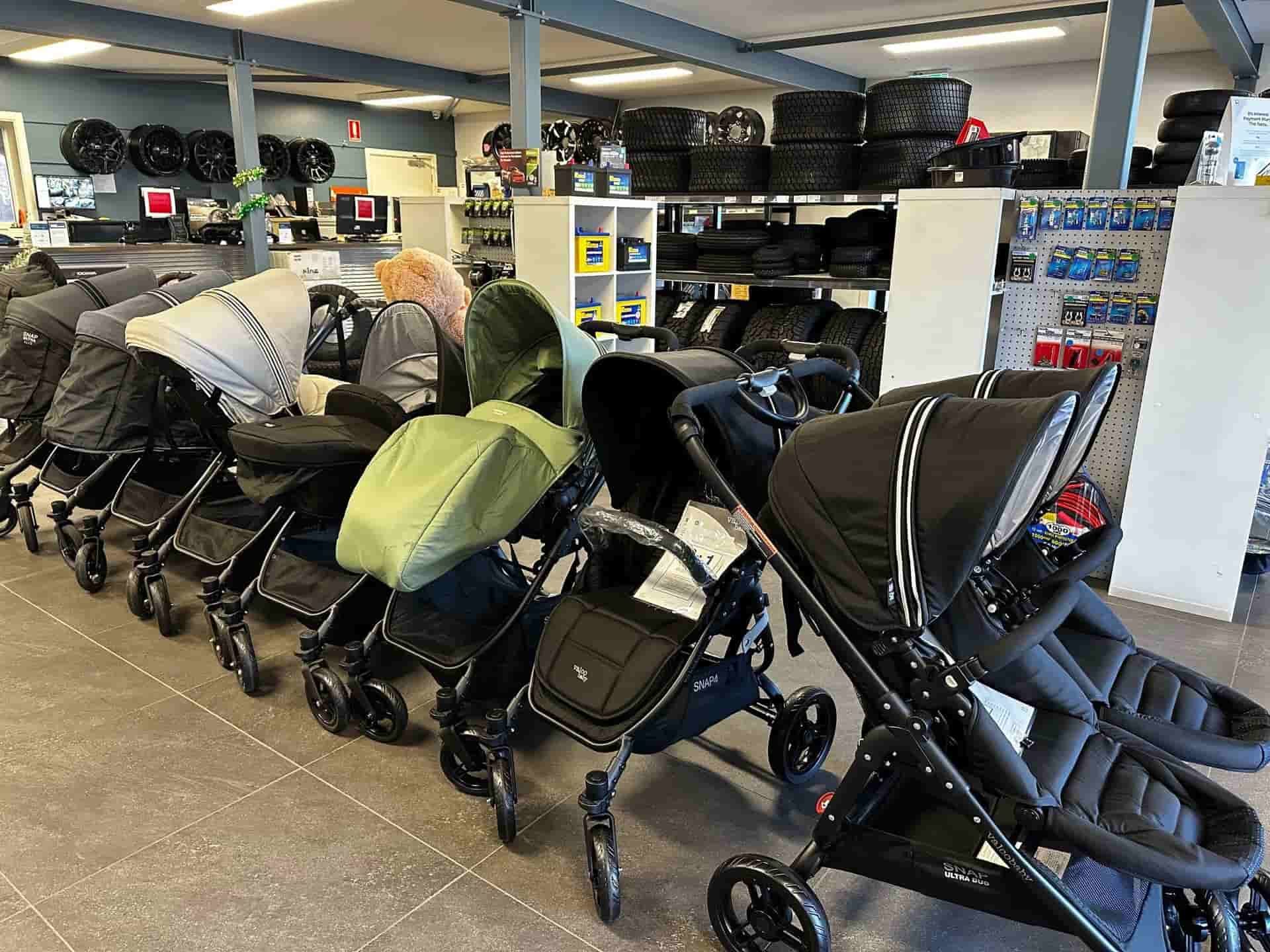 A Row Of Baby Strollers Are Lined Up In A Store — Smitty's Tyres & More In Taminda, NSW