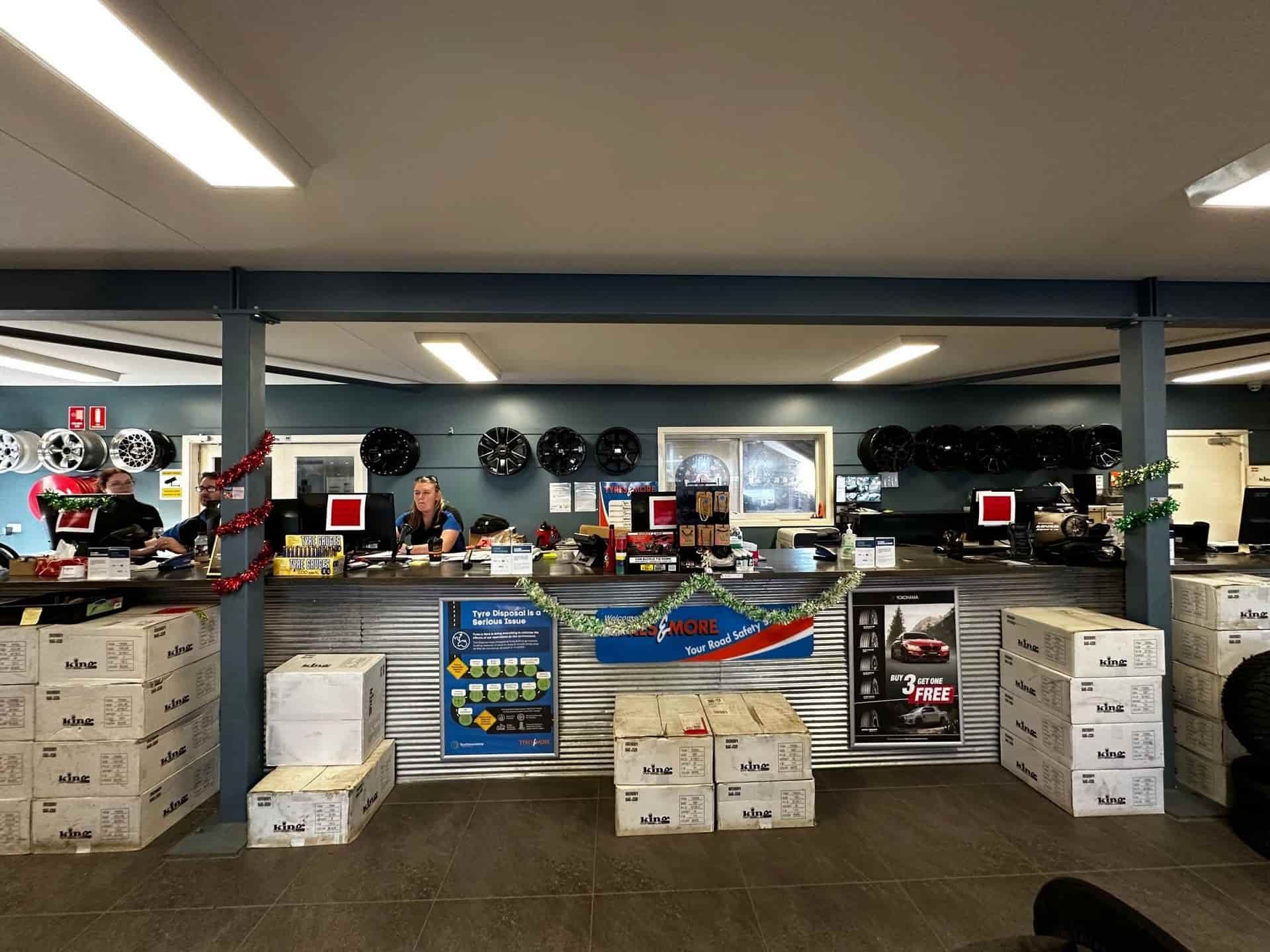 A Store Filled With Lots Of Boxes And A Counter — Smitty's Tyres & More In Taminda, NSW