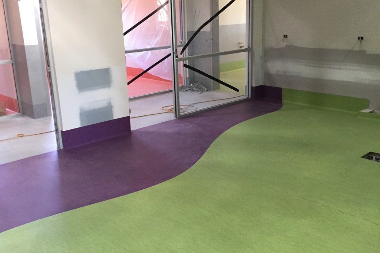 Purple and Green Flooring Under Construction — Ozwide Flooring in Ciccone, NT