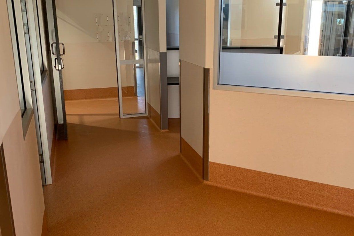 Orange Floor of a Corridor — Ozwide Flooring in Ciccone, NT