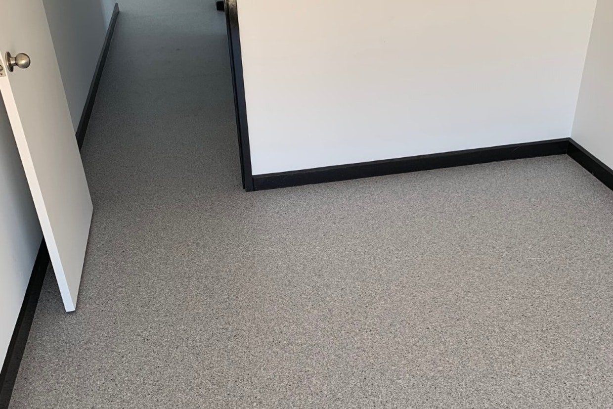 White Flooring Installed Around Corner — Ozwide Flooring in Ciccone, NT