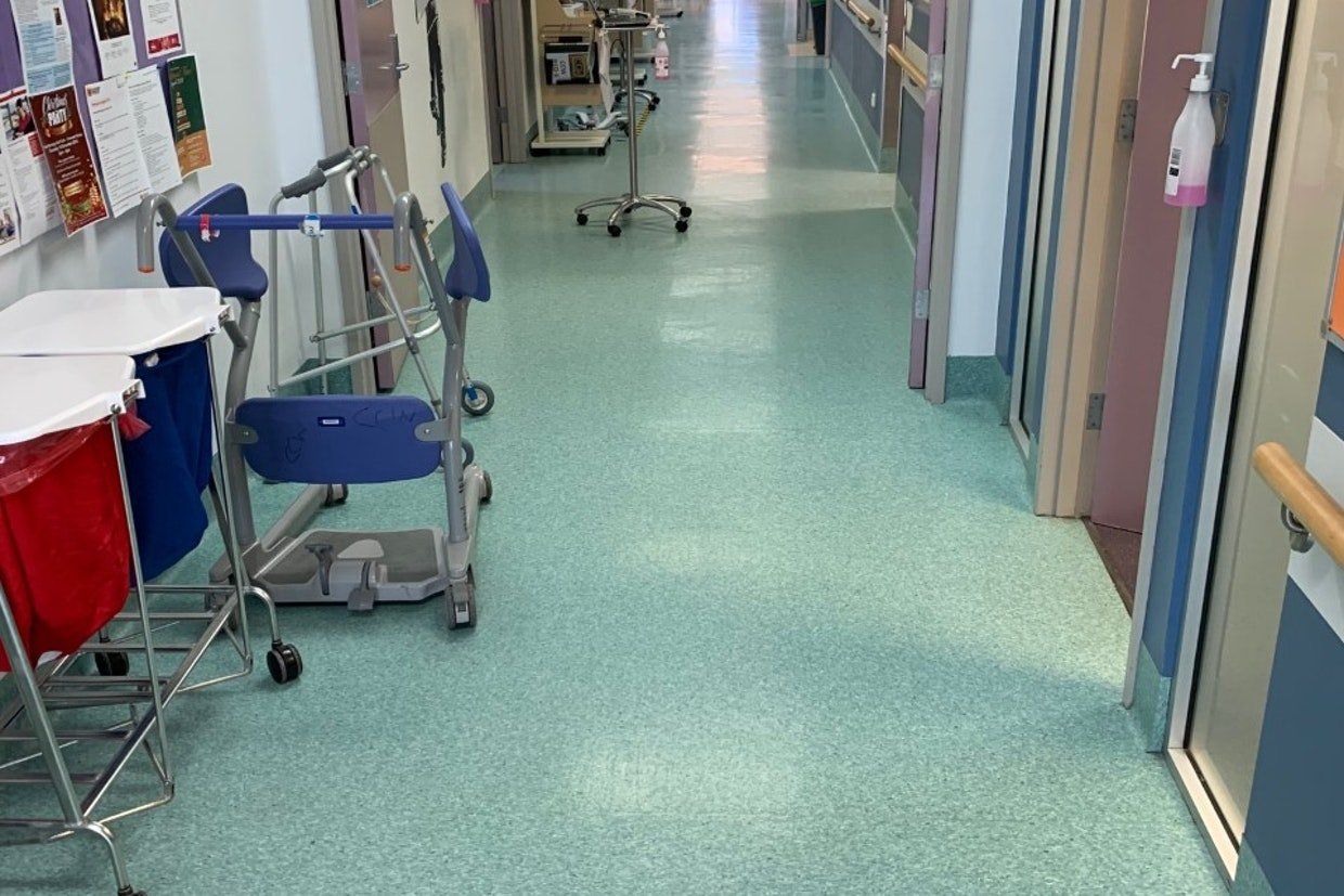 Blue Flooring on Corridor — Ozwide Flooring in Ciccone, NT