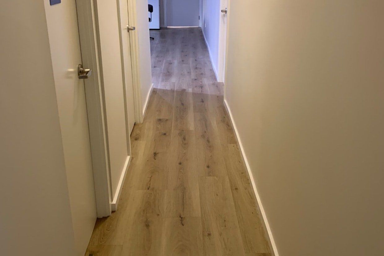 Vertical Light Brown Wooden Flooring — Ozwide Flooring in Ciccone, NT