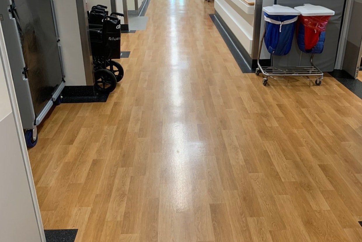 Wooden Flooring with Wheelchair on the Side — Ozwide Flooring in Ciccone, NT