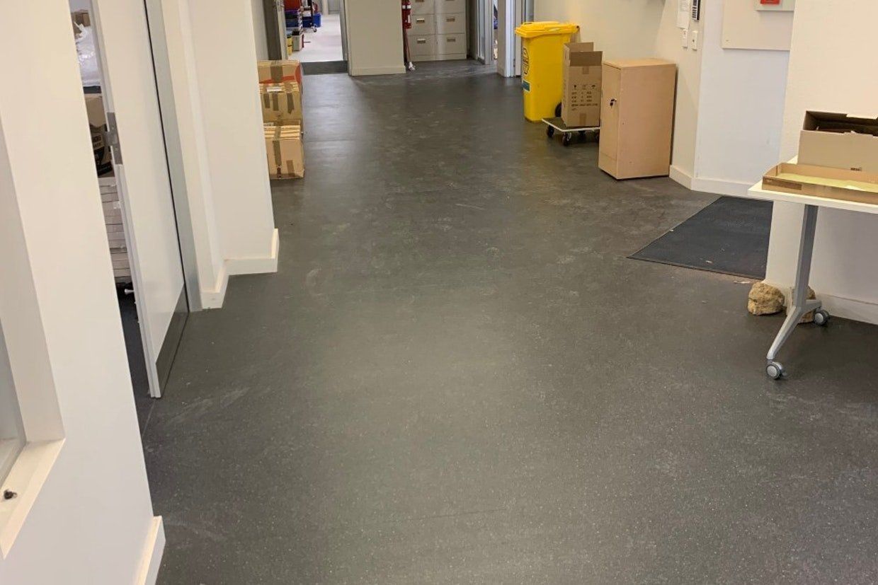 Newly Finish Black Flooring of a Hallway — Ozwide Flooring in Ciccone, NT
