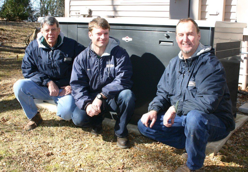 GenSpring Power Team Proudly Surrounding a New Generator for a Georgia Home.