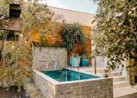 There is a plunge pool in the backyard of an Australian  house.