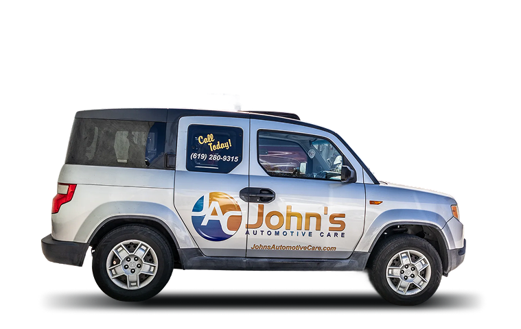 A silver SUV with stacked tires, advertising