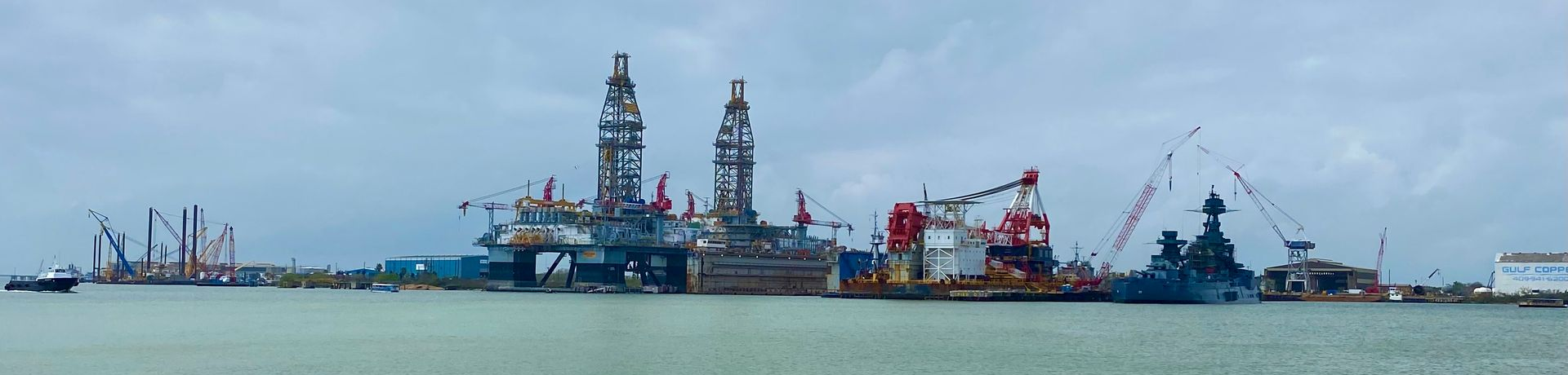 Port of Galveston Port of Galveston with ships and cranes along the harbor.