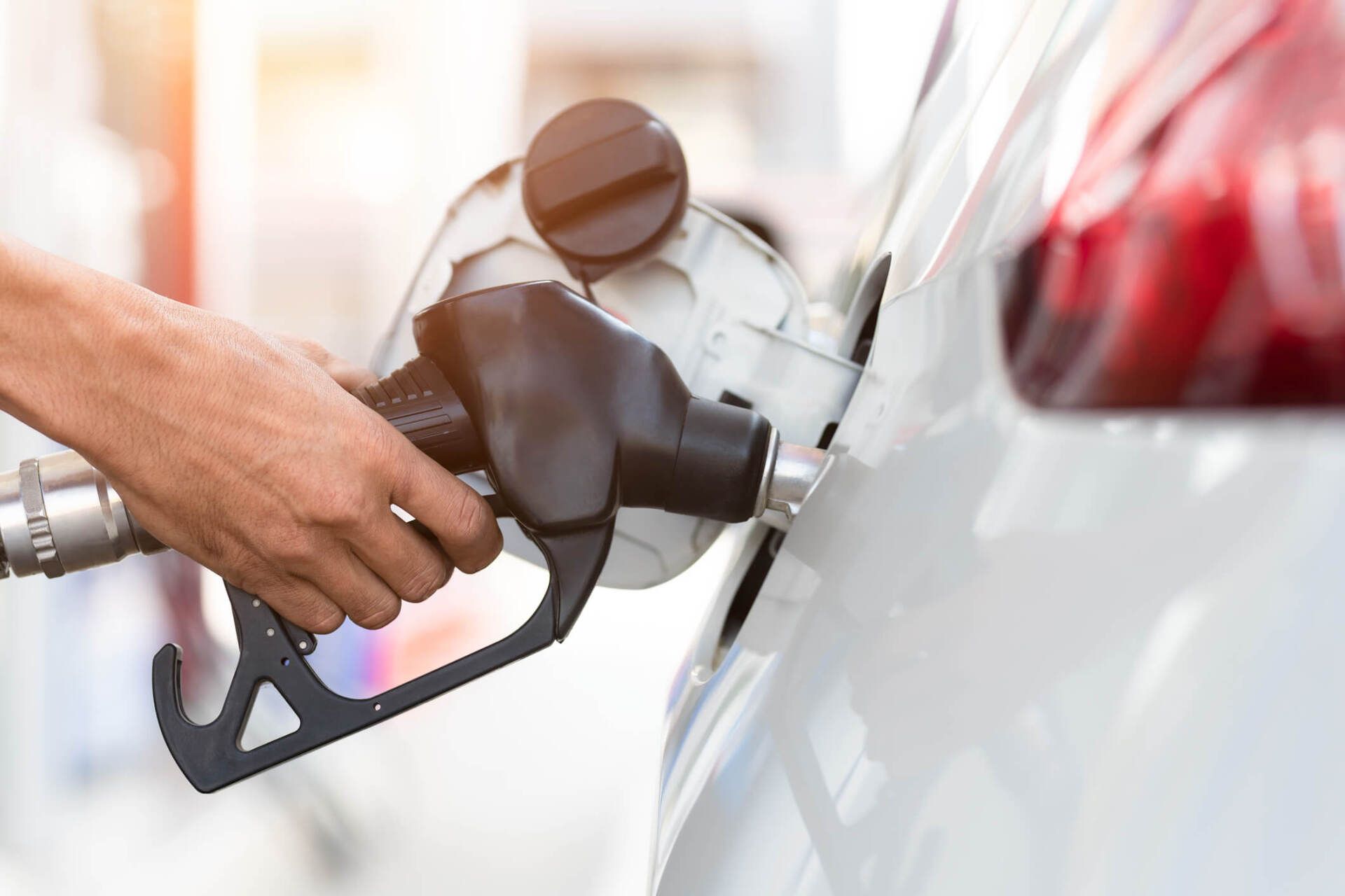  Hand Refilling the Car with Fuel — Asheville, NC — Biltmore Oil