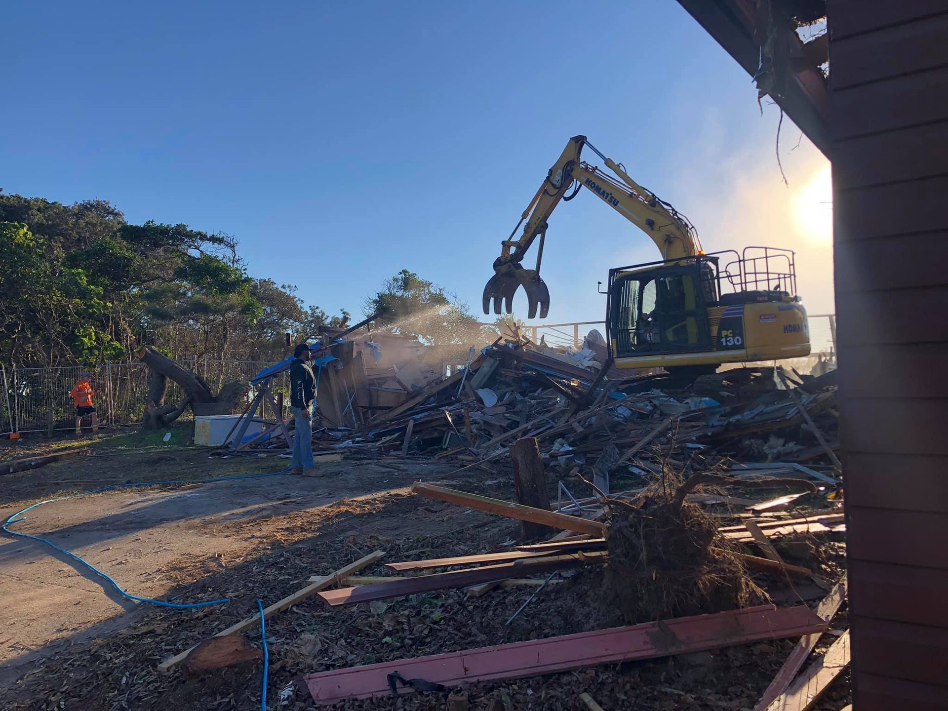 Yellow Excavator Doing Commercial Demolition