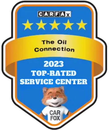 CARFAX 2023 Top-Rated Service Center award. Blue shield with gold banner. Car Fox mascot.