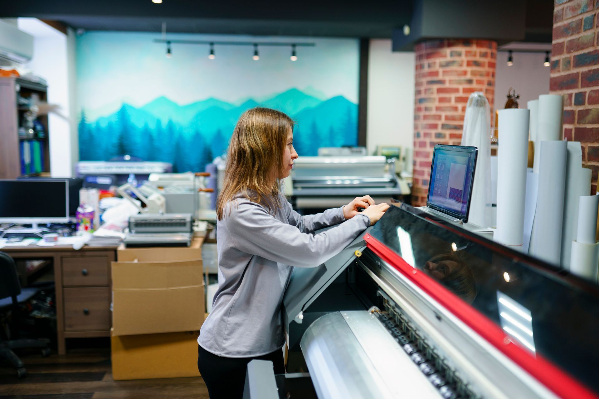Woman working in printing studio.