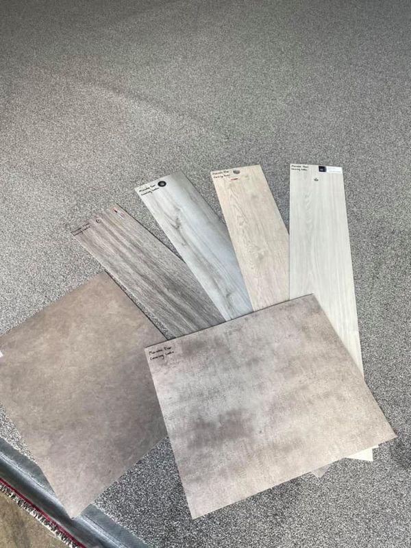 Assortment Of Tile Samples In Various Wood Grain And Stone Patterns — Mareeba Floor Covering Centre in Mareeba, QLD