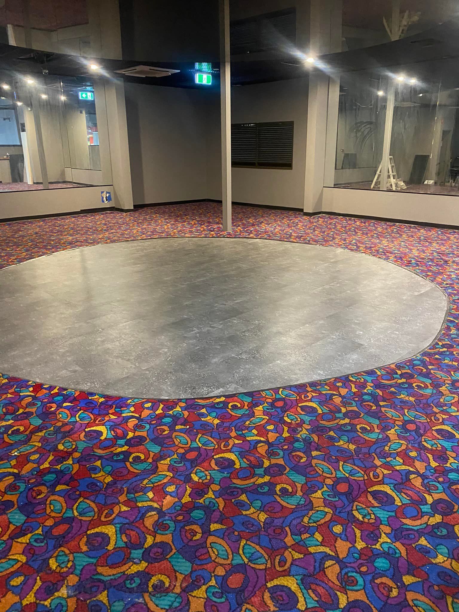 A Circular Dance Floor With A Pole — Mareeba Floor Covering Centre in Tablelands, QLD