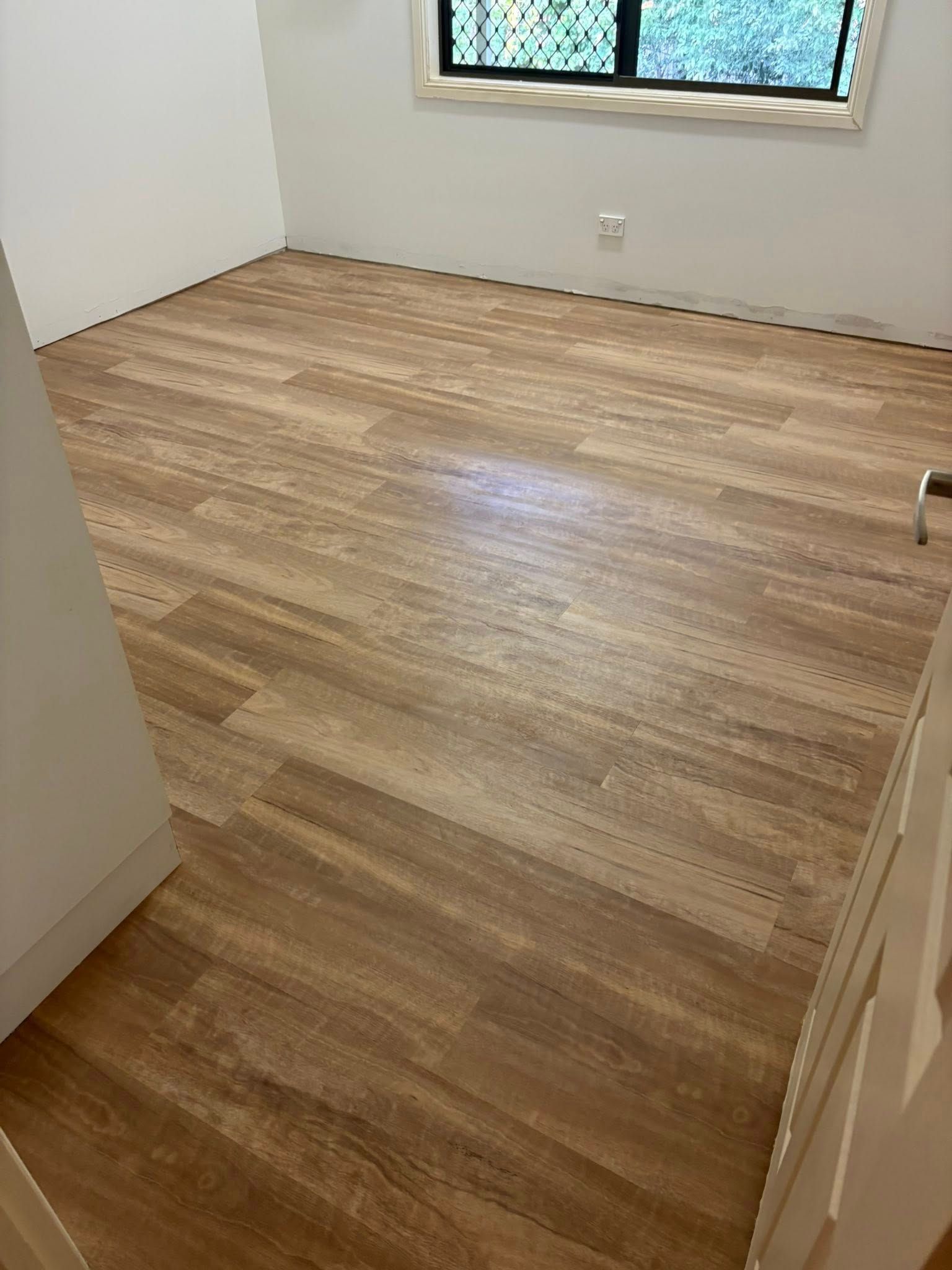 Living Room With Light Wood Floors, Beige Furniture — Mareeba Floor Covering Centre in Cassowary Coast, QLD