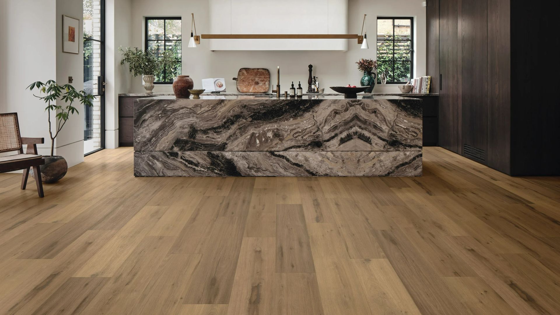 Wooden Floor In A Modern Kitchen With A Large Marble Island — Mareeba Floor Covering Centre in Cape York, QLD