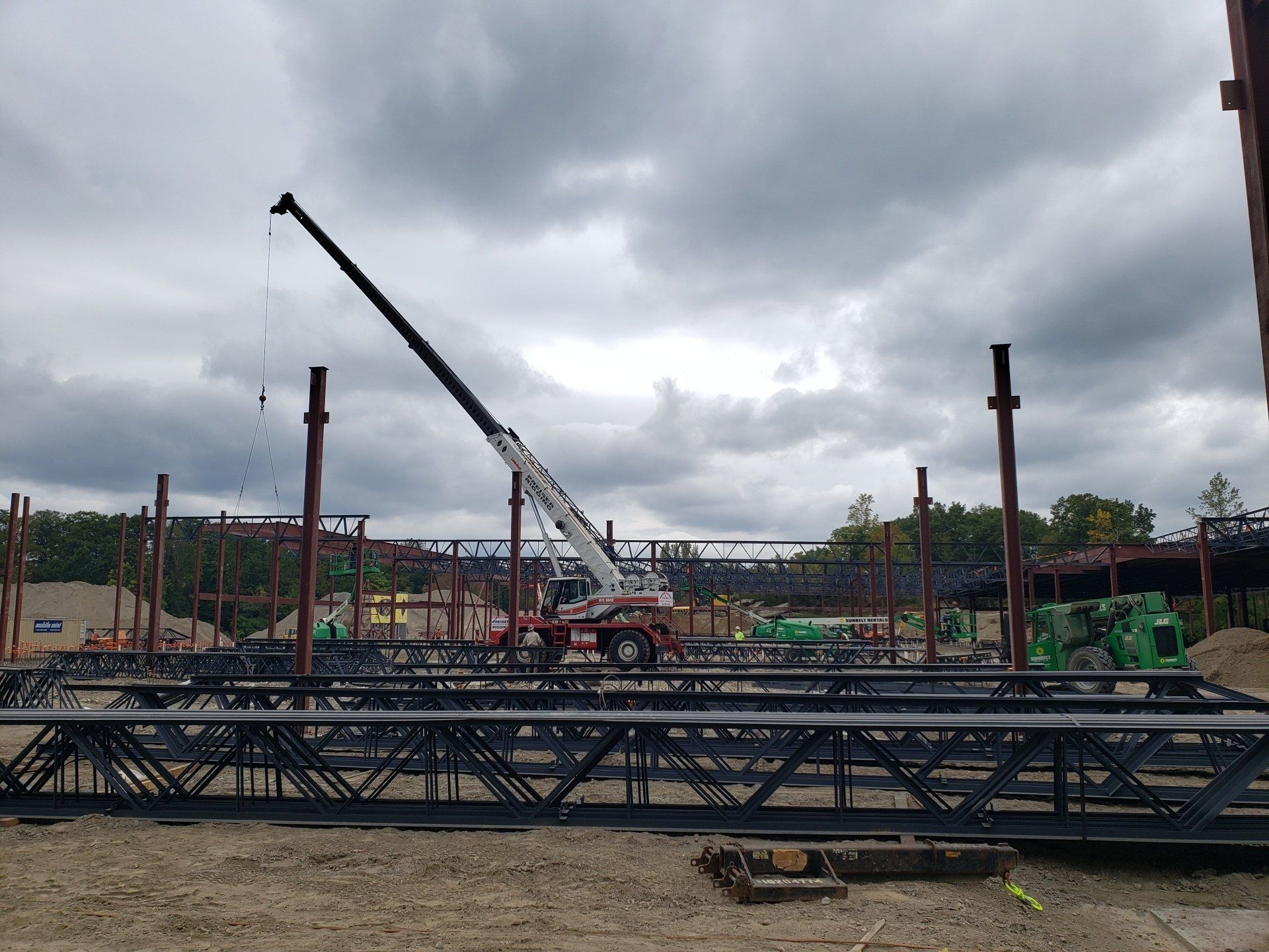 A construction site with a crane in the middle of it