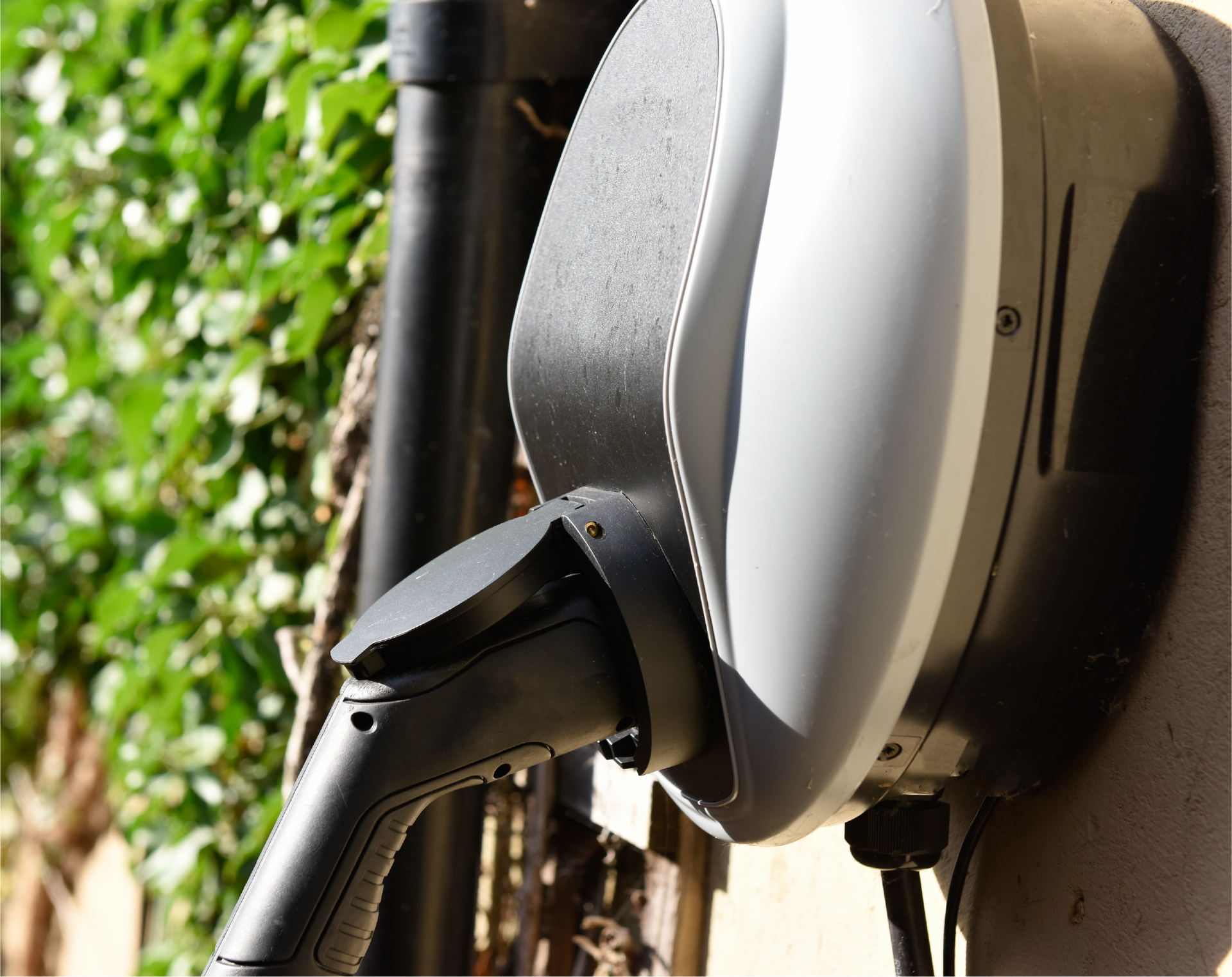 A person is charging an electric car with a charger.