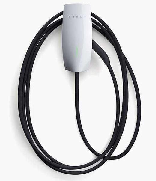 A black device with a green circle on it that says `` ev charge point ''.