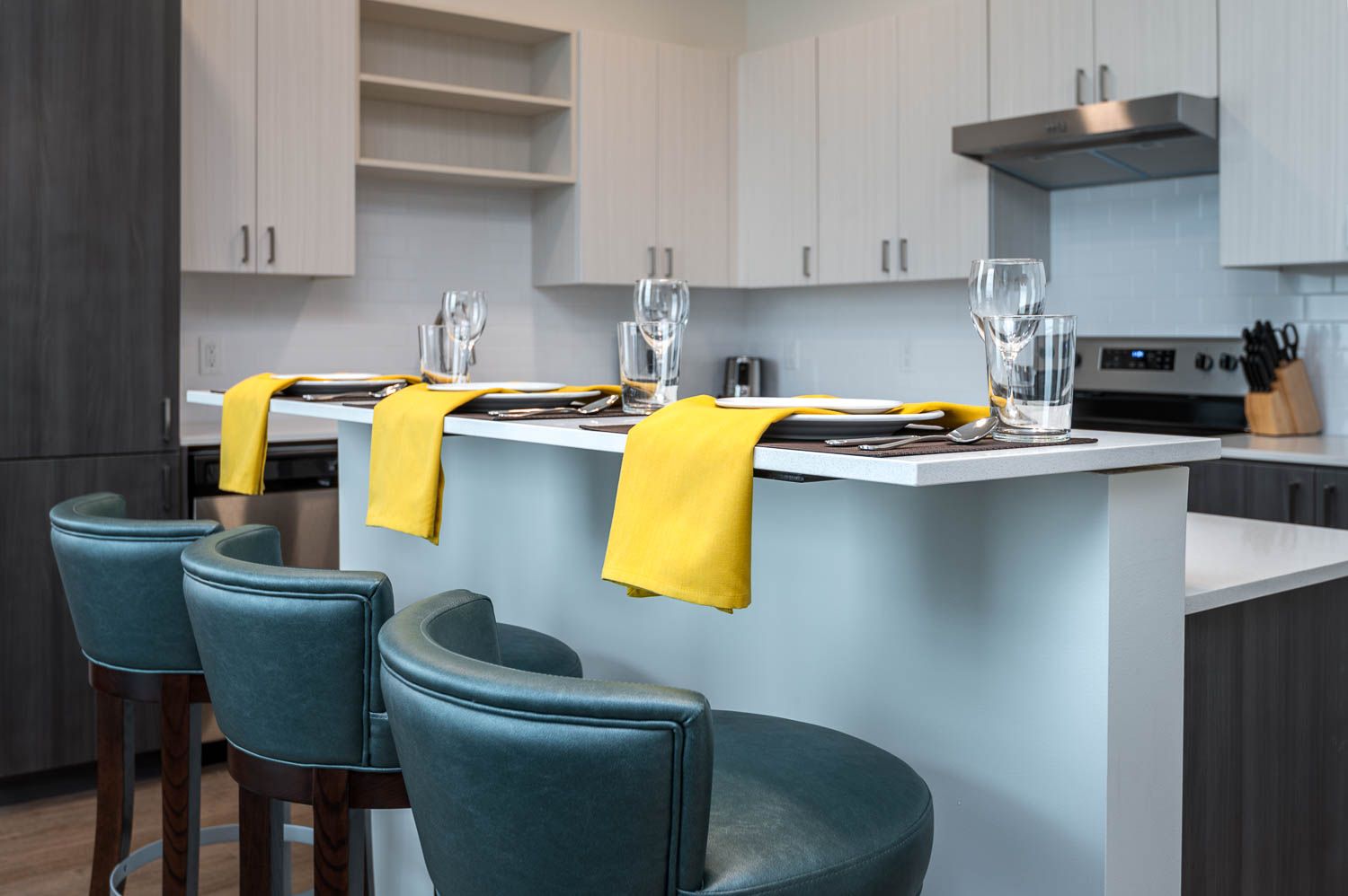 photo of kitchen with blue bar stools