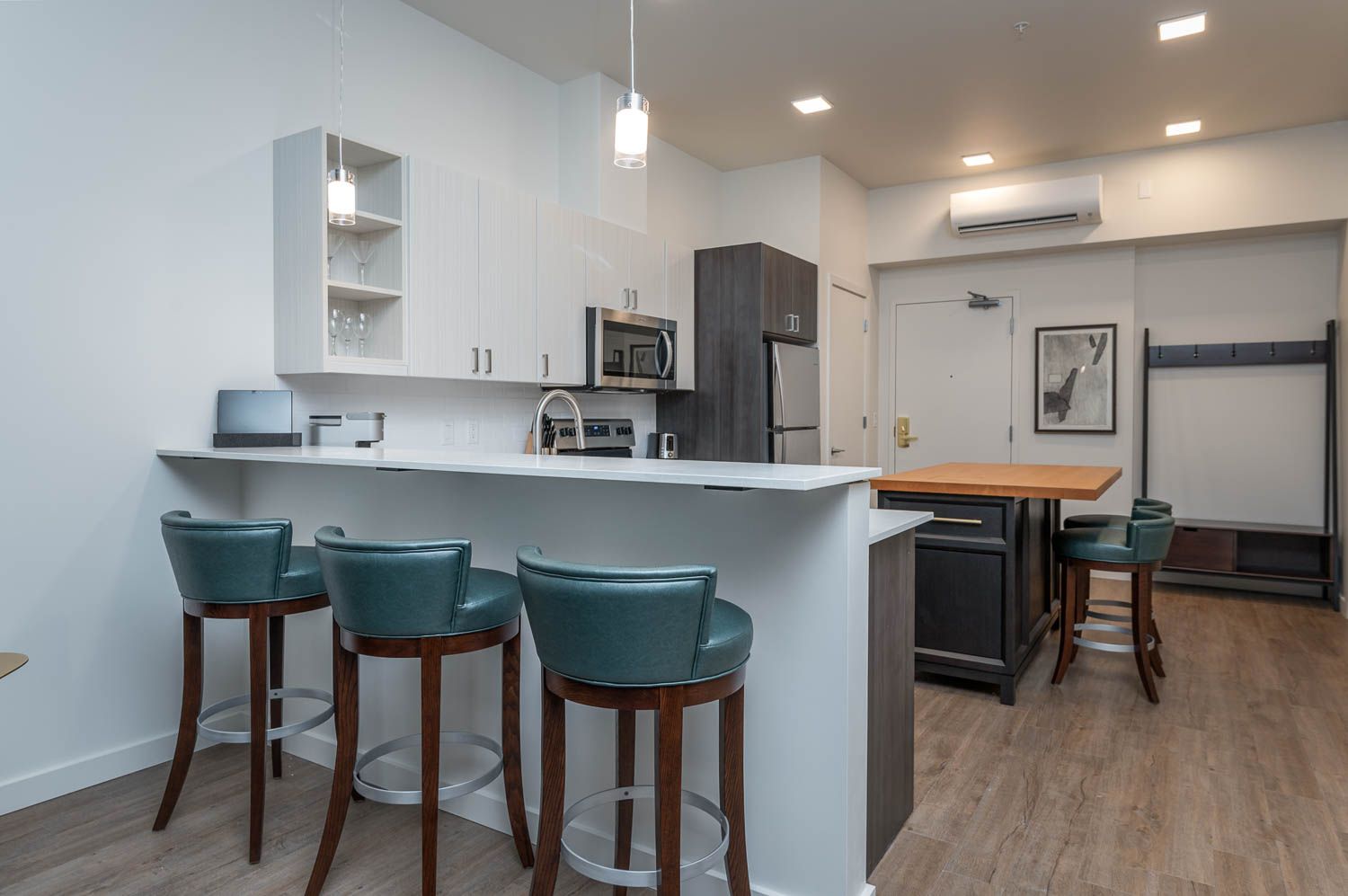 photo of kitchen with blue bar stools