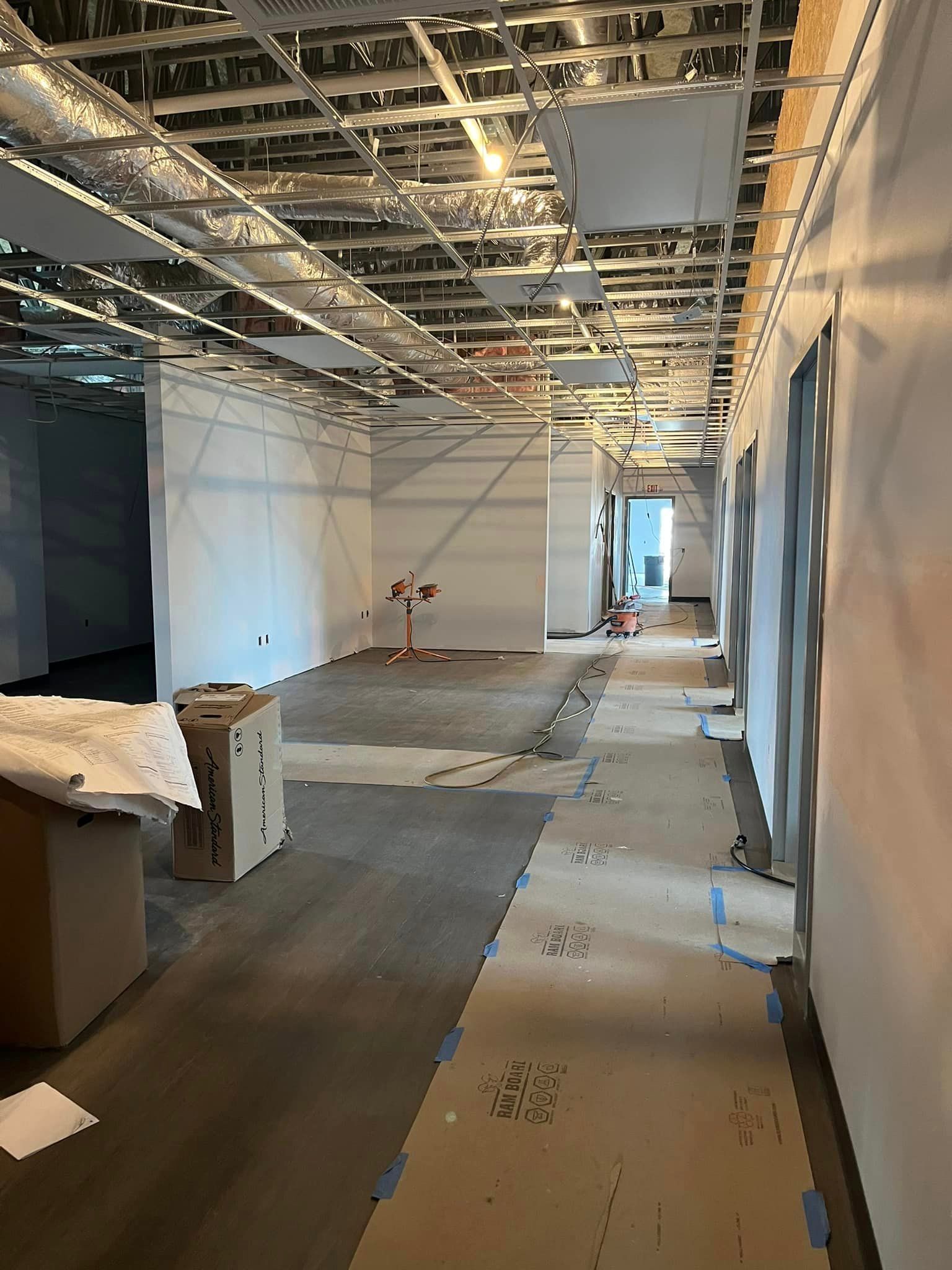 A long hallway in a building under construction.