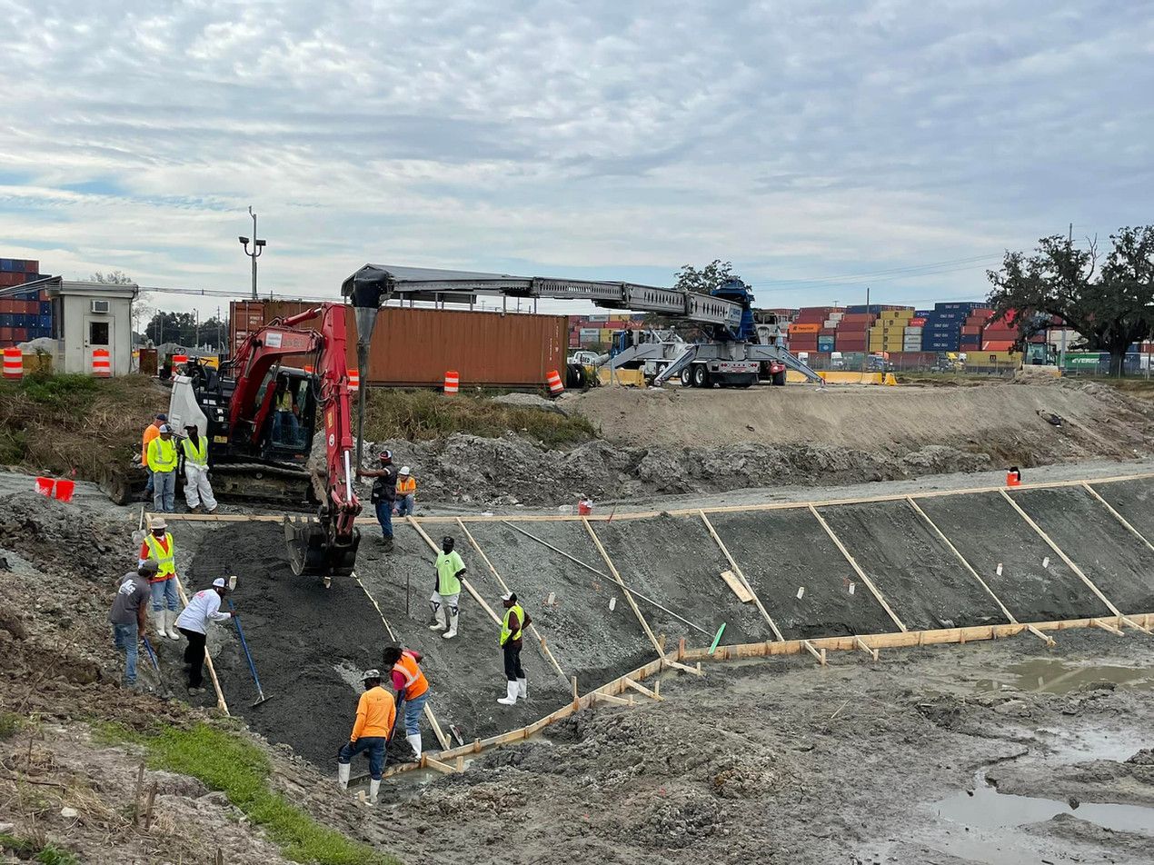 A group of construction workers are working on a construction site.