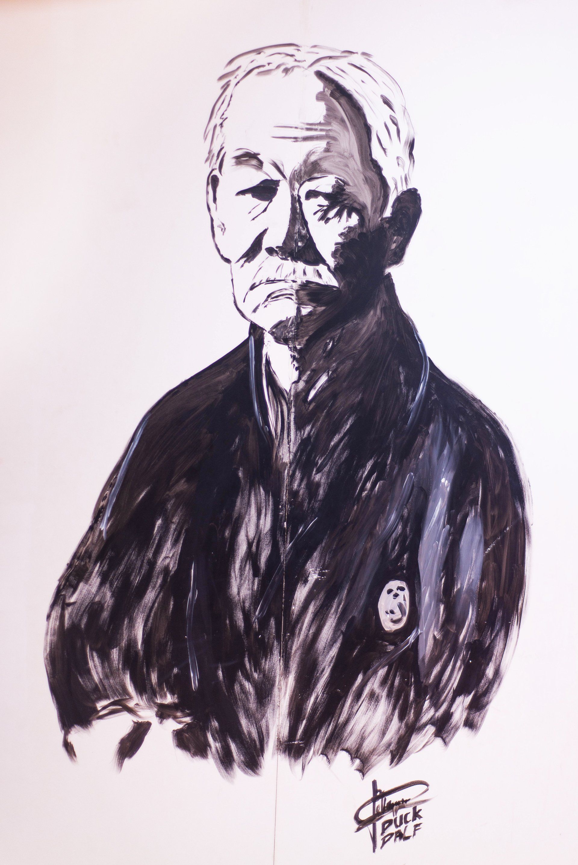 Een zwart-wit tekening van een man met een baard